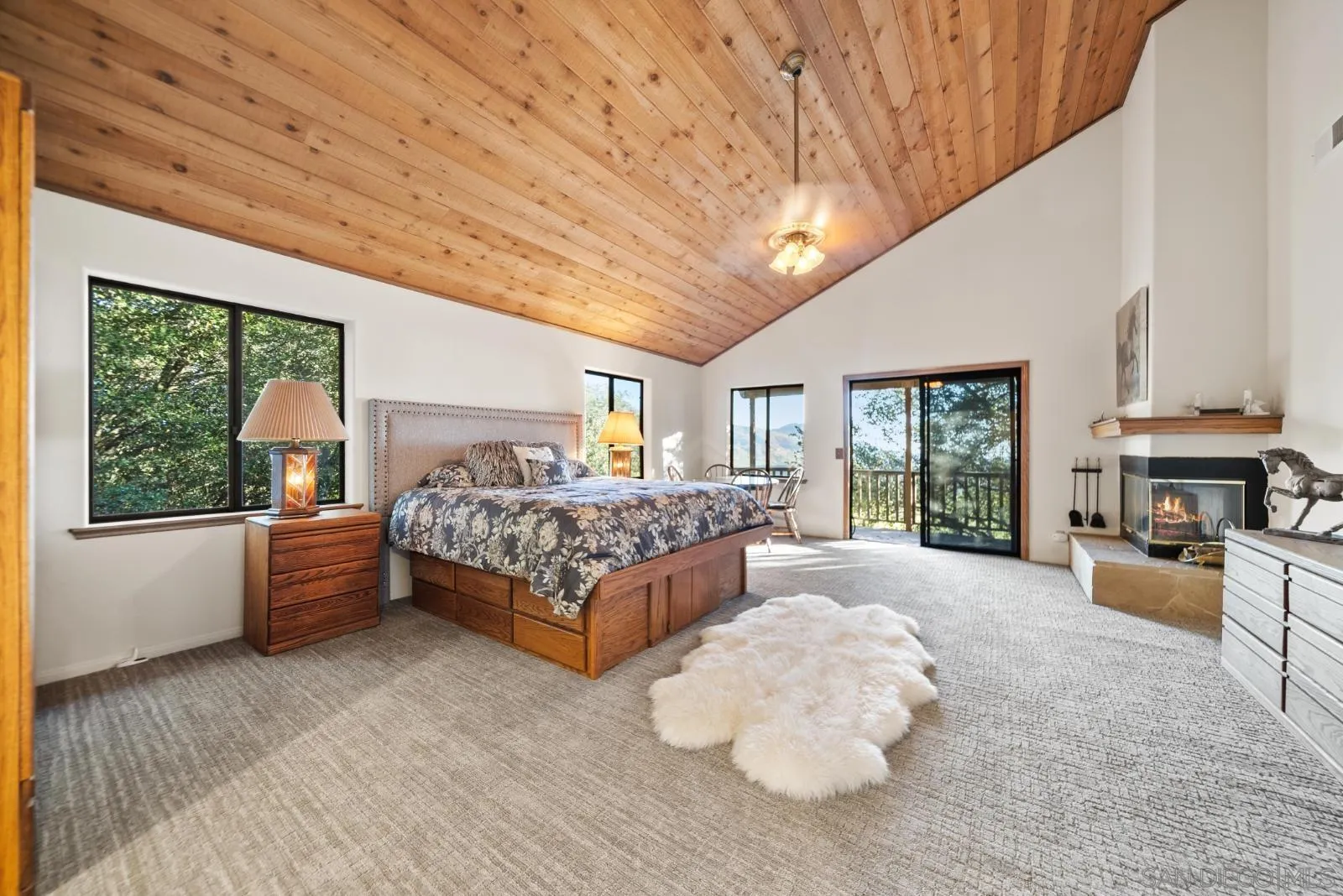 a bed room with a bed and a large window