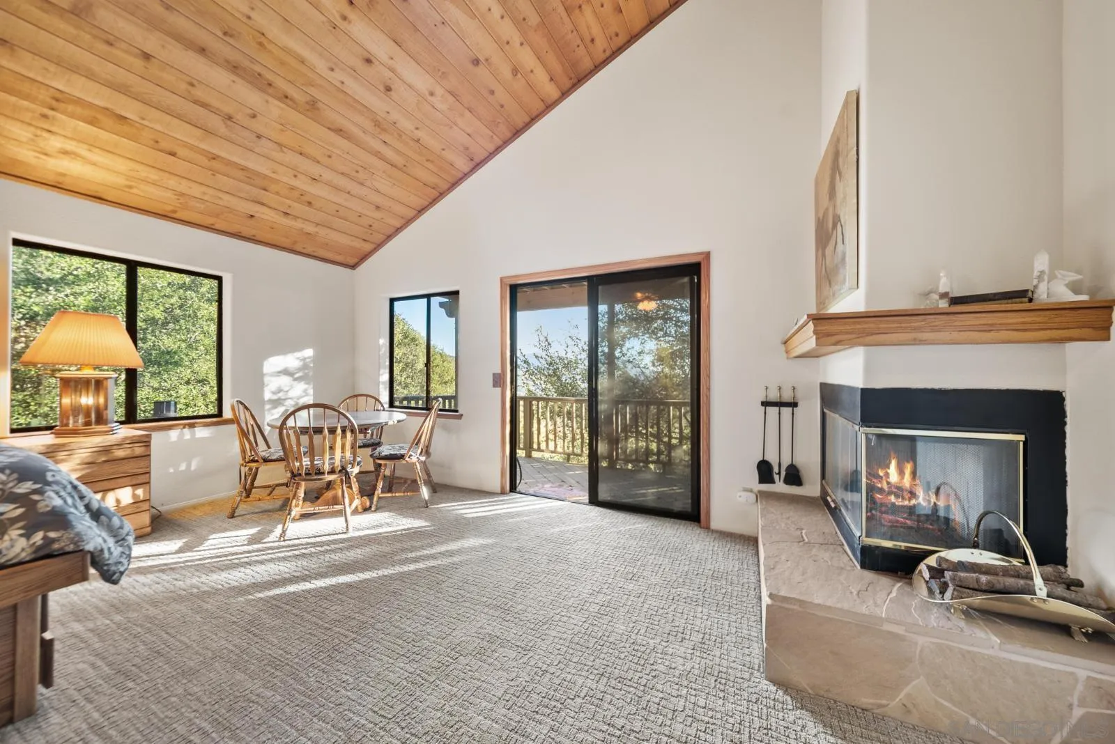 4641 Luneta View Julian, CA 92036 - Photo 37 of 56 a living room with furniture a fireplace and large windows