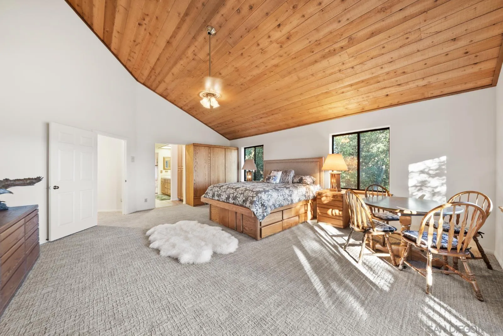 4641 Luneta View Julian, CA 92036 - Photo 38 of 56 a spacious bedroom with a bed and large windows