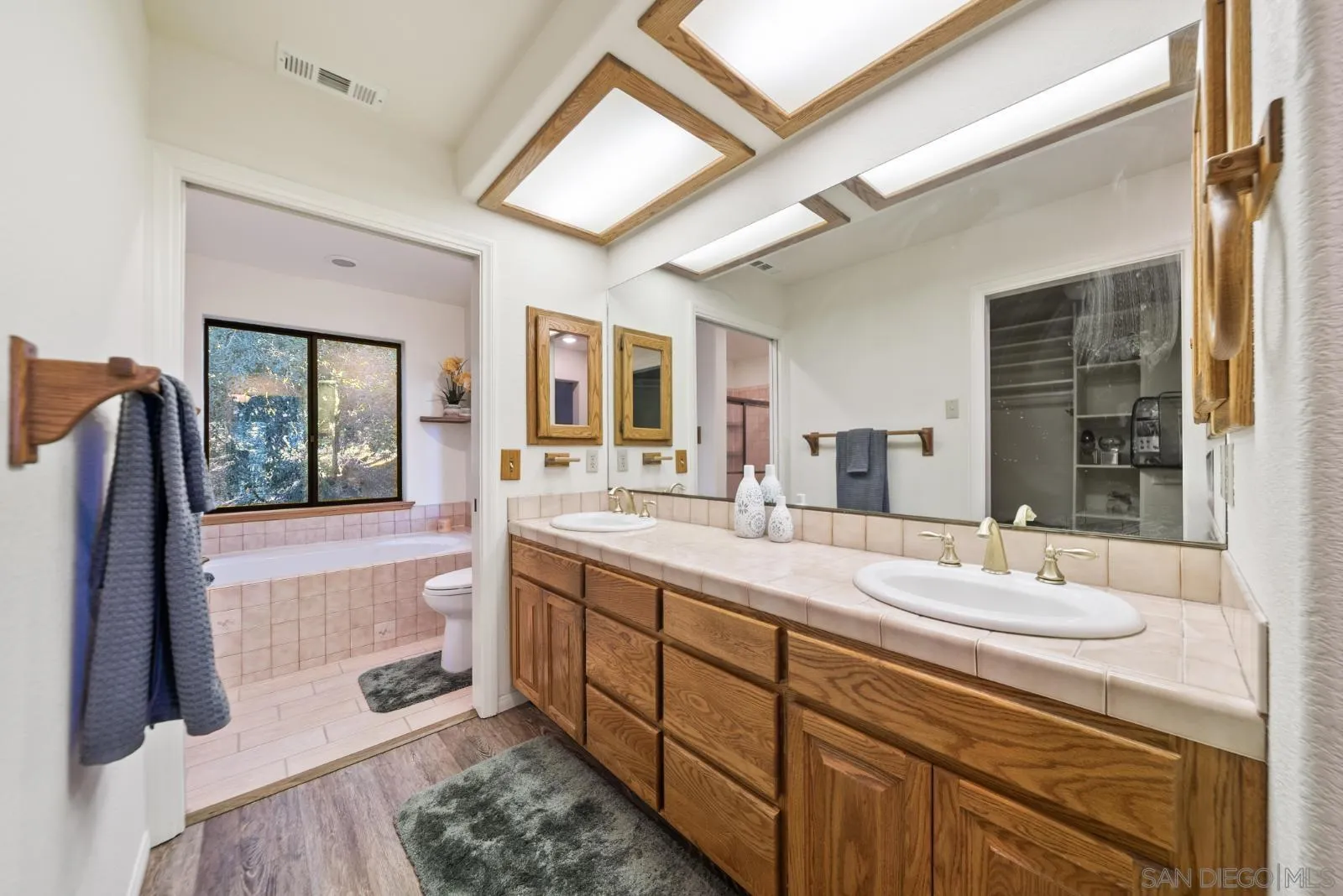 4641 Luneta View Julian, CA 92036 - Photo 43 of 56 a spacious bathroom with a sink double vanity and a mirror
