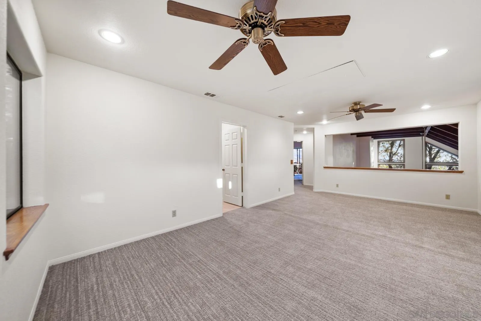 4641 Luneta View Julian, CA 92036 - Photo 45 of 56 an empty room with ceiling fan and windows