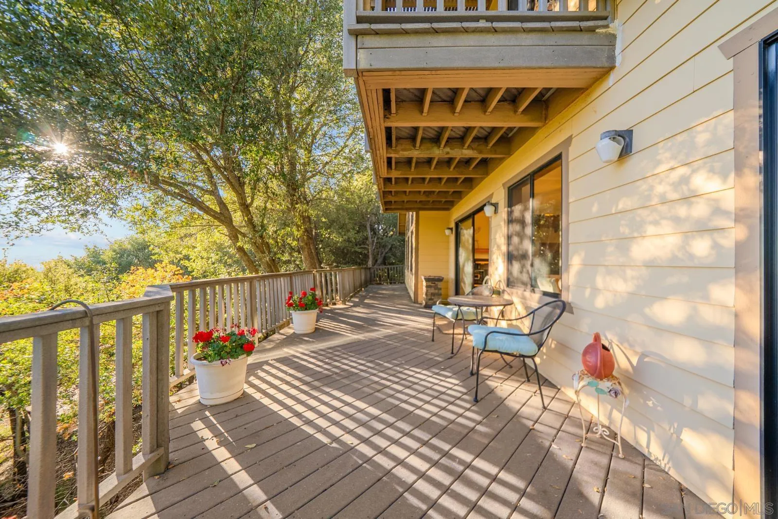 4641 Luneta View Julian, CA 92036 - Photo 7 of 56 a view of a balcony with chairs and wooden floor