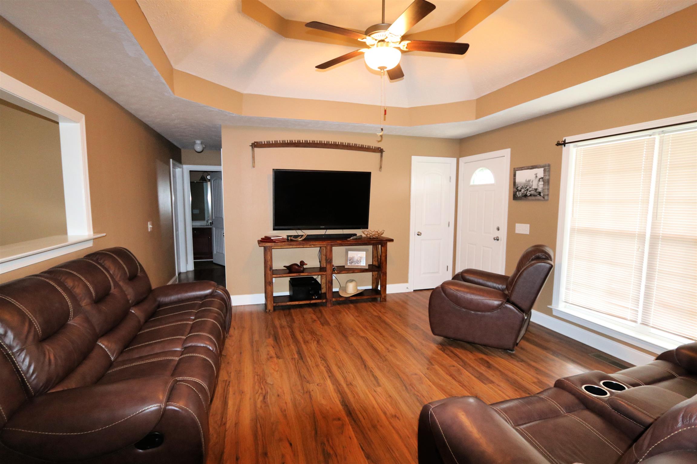5650 Lakeview Road Springfield, TN 37172 - Photo 4 of 14 a living room with furniture a fireplace and a flat screen tv
