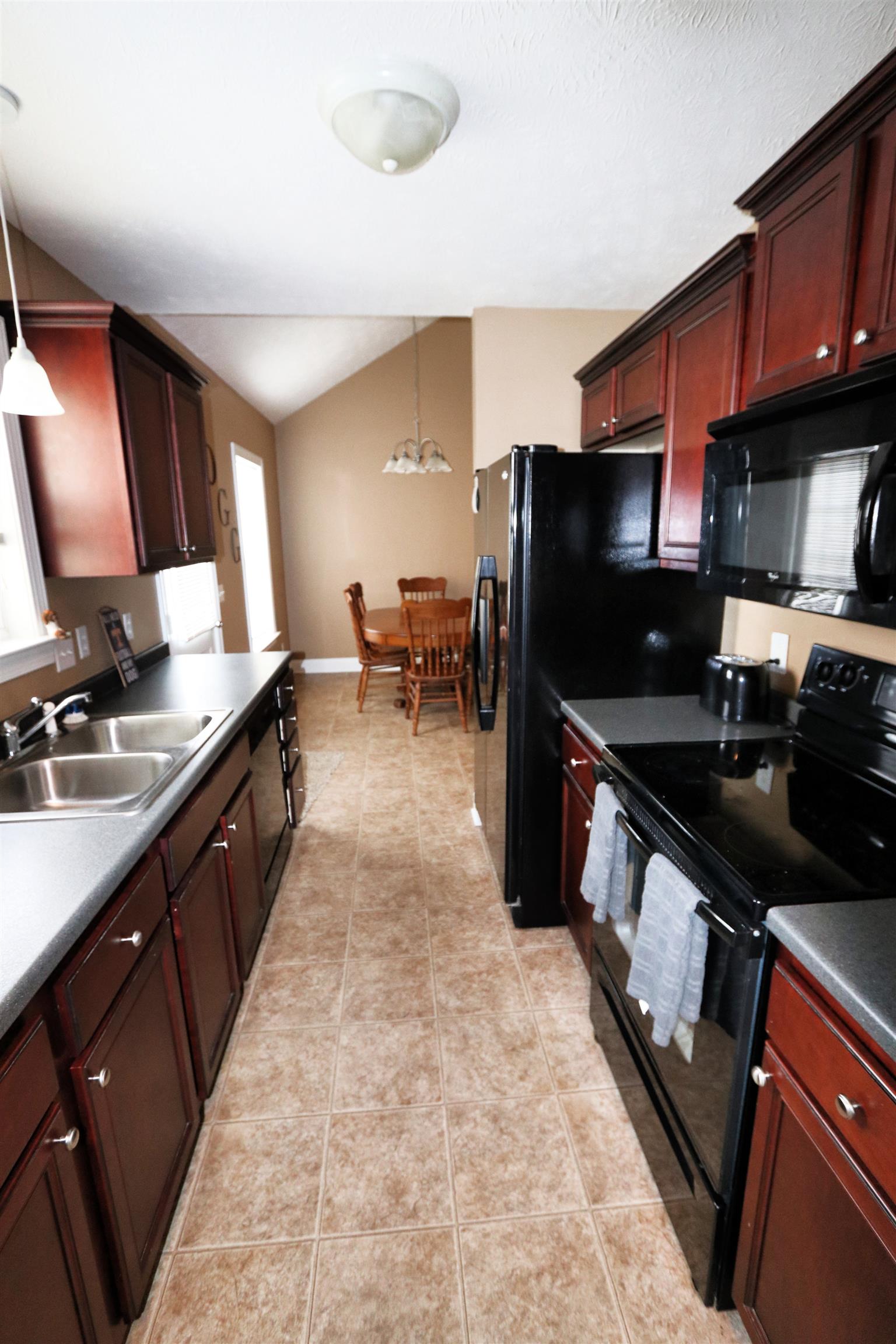 5650 Lakeview Road Springfield, TN 37172 - Photo 5 of 14 a kitchen with stainless steel appliances a sink stove and refrigerator