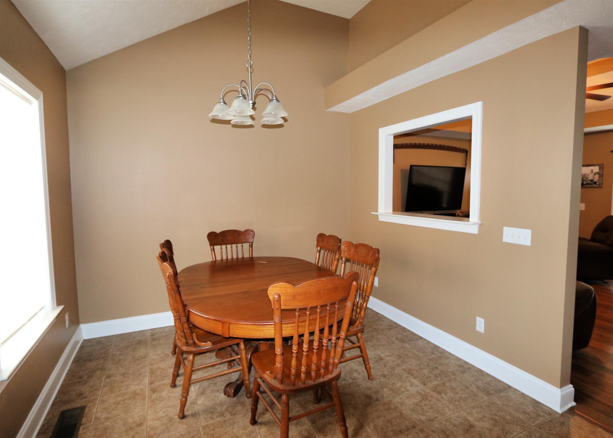 5650 Lakeview Road Springfield, TN 37172 - Photo 8 of 14 a view of a dining room with furniture and chandelier