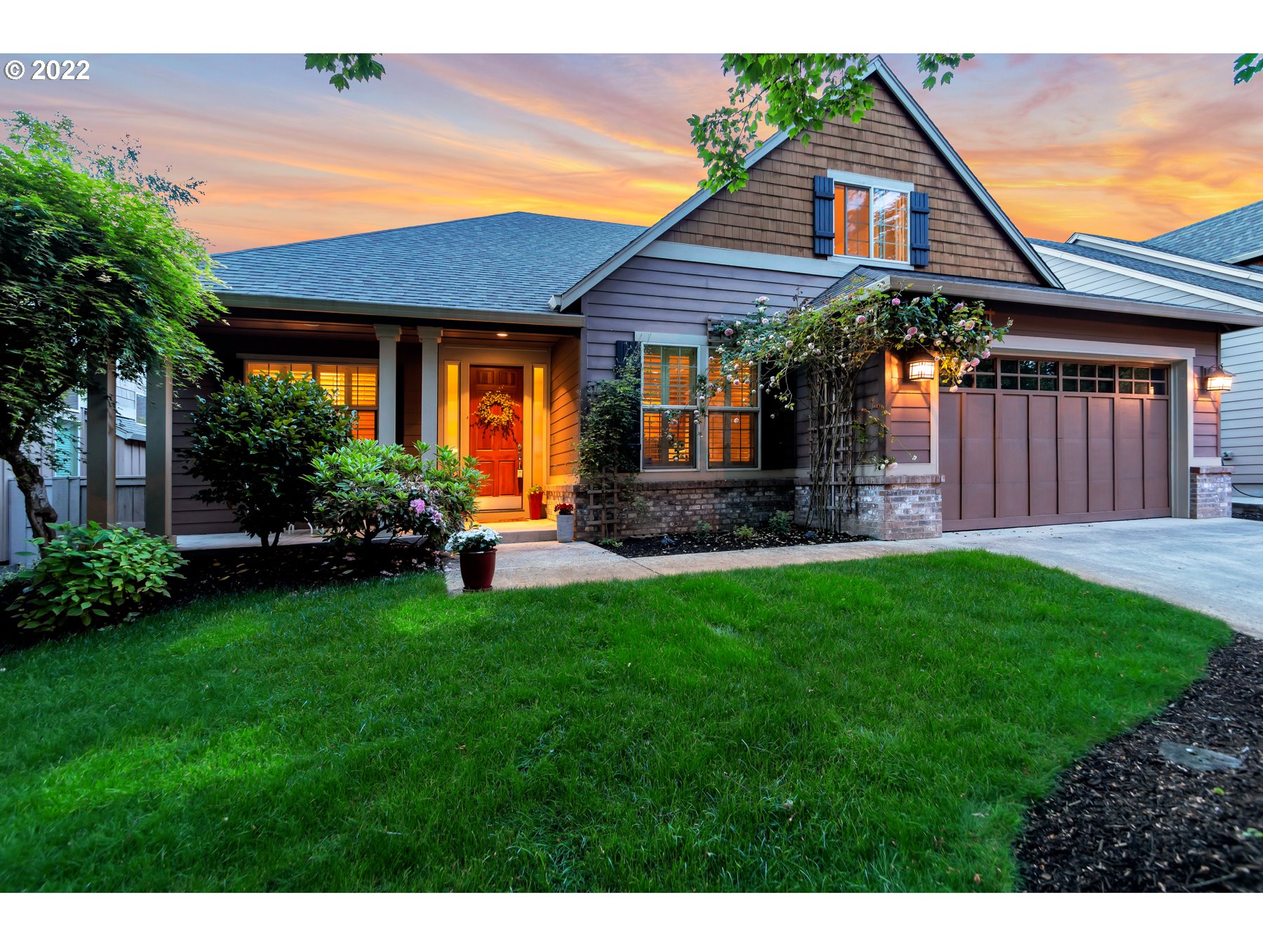 a front view of a house with a yard