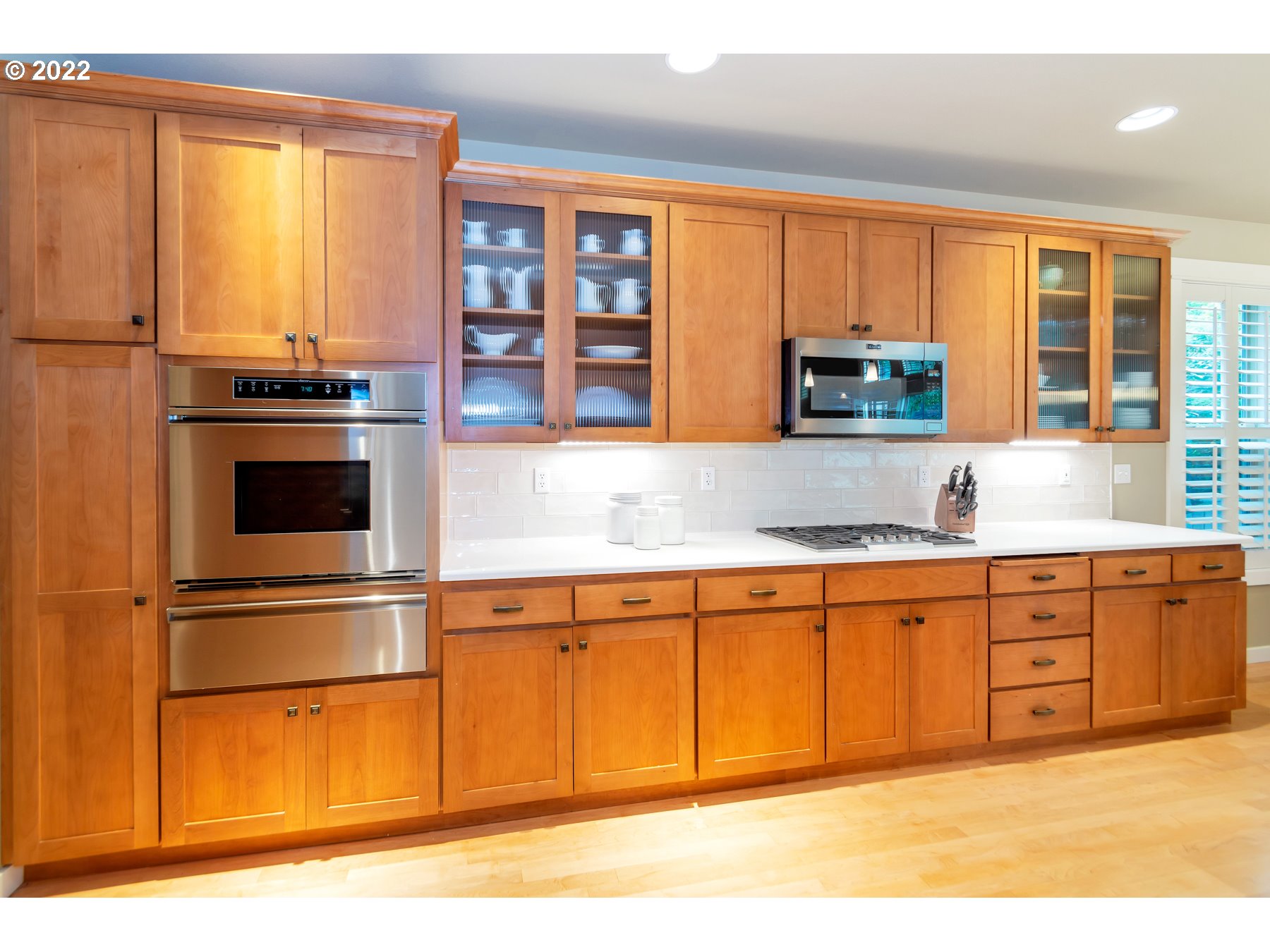 19704 Southeast 26th Way Camas, WA 98607 - Photo 14 of 32 a kitchen with stainless steel appliances granite countertop a stove and a sink