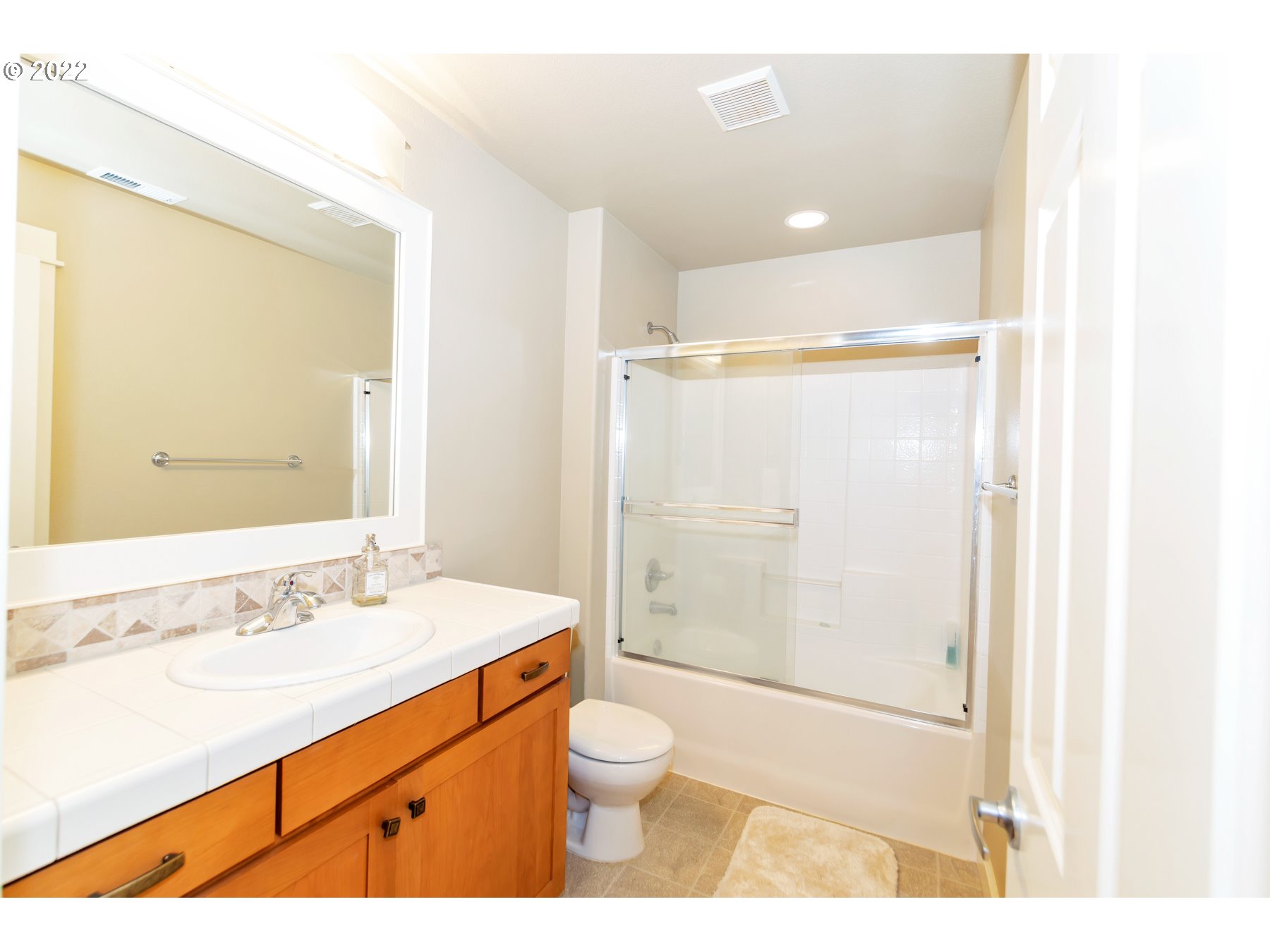 19704 Southeast 26th Way Camas, WA 98607 - Photo 16 of 32 a bathroom with a sink a toilet and shower