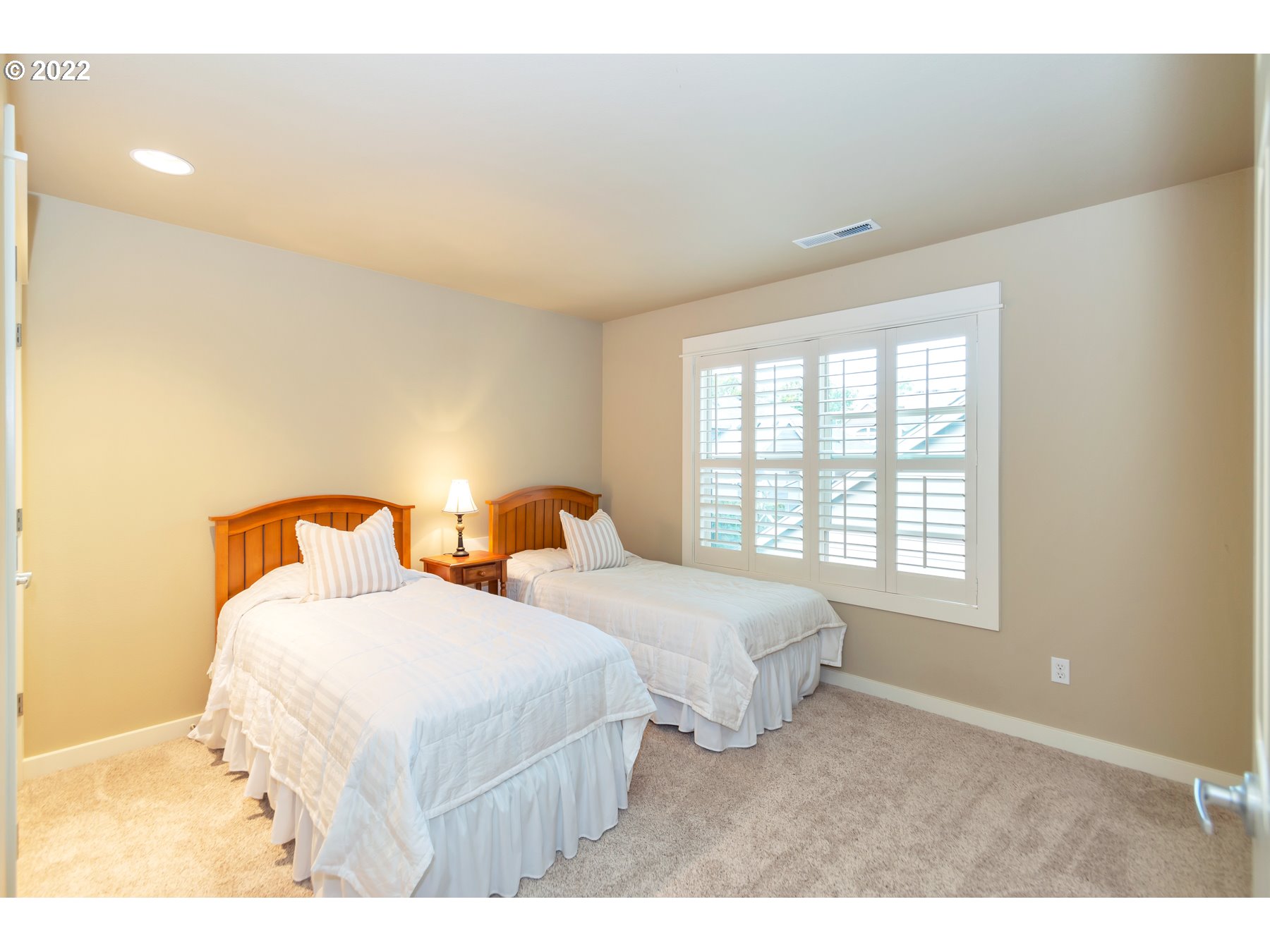 19704 Southeast 26th Way Camas, WA 98607 - Photo 17 of 32 a bedroom with two beds and a window with outer view