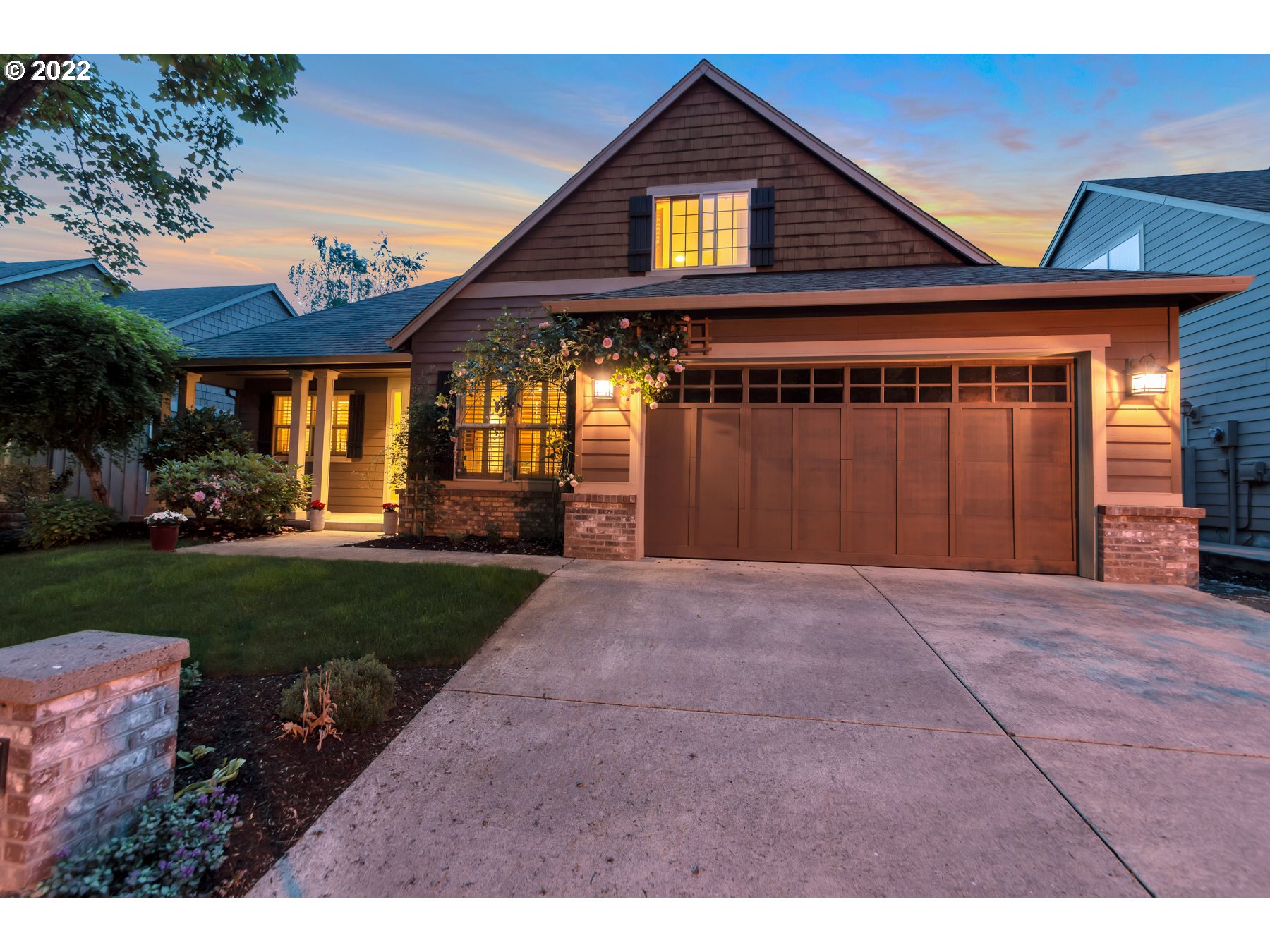 19704 Southeast 26th Way Camas, WA 98607 - Photo 30 of 32 a front view of a house with a yard and garage