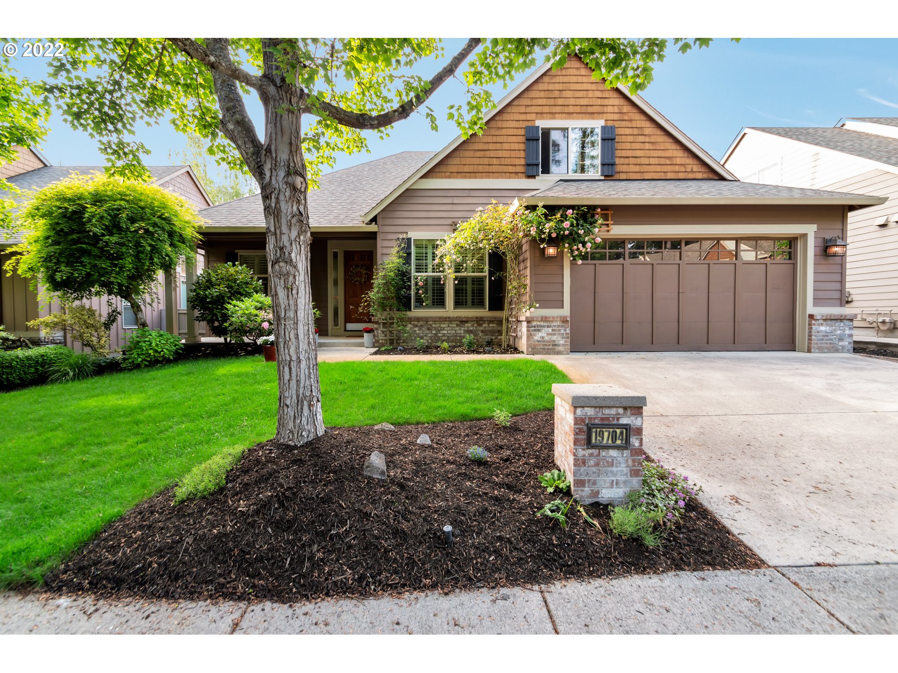 19704 Southeast 26th Way Camas, WA 98607 - Photo 3 of 32 a front view of a house with garden
