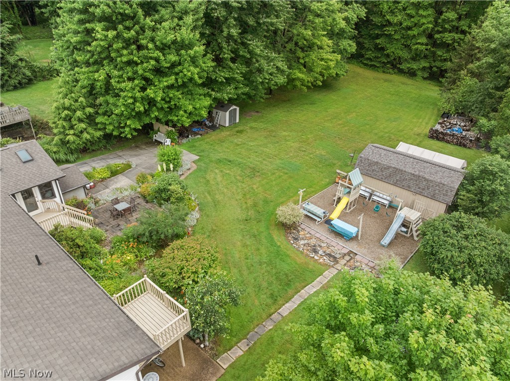 1835 Lynn Road Kent, OH 44240 - Photo 46 of 48 Expansive green property featuring a stone patio, multiple decks, and mature trees