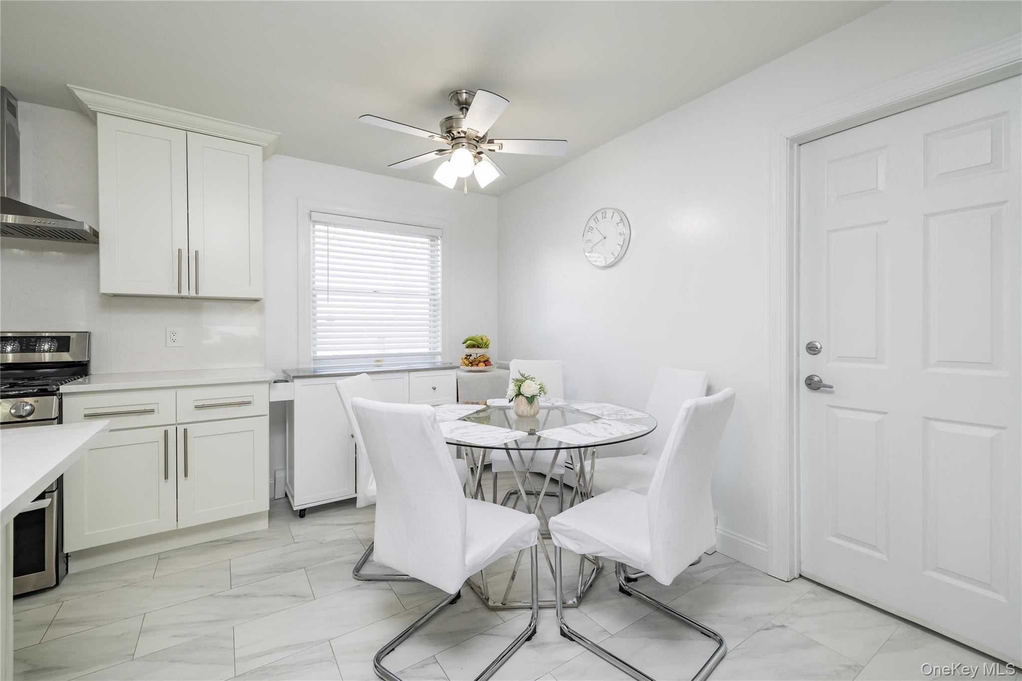 458 East Pine Street Long Beach, NY 11561 - Photo 5 of 26 a view of a dining room with furniture and chandelier