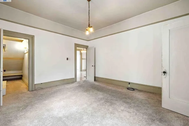 an empty room with a view of a bathroom