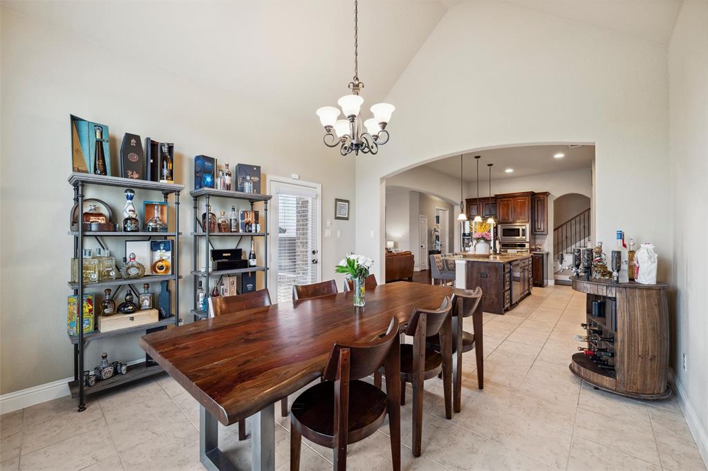 112 Shepherds Hill Road Waxahachie, TX 75165 - Photo 13 of 38 a view of a dining room with furniture and a chandelier