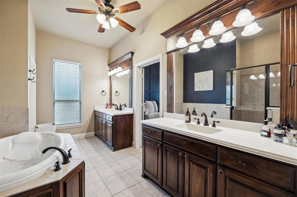 112 Shepherds Hill Road Waxahachie, TX 75165 - Photo 16 of 38 a bathroom with a sink double vanity and a mirror