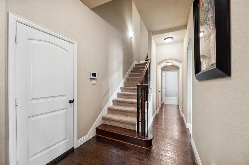 112 Shepherds Hill Road Waxahachie, TX 75165 - Photo 24 of 38 a view of a hallway with entryway wooden floor and front door
