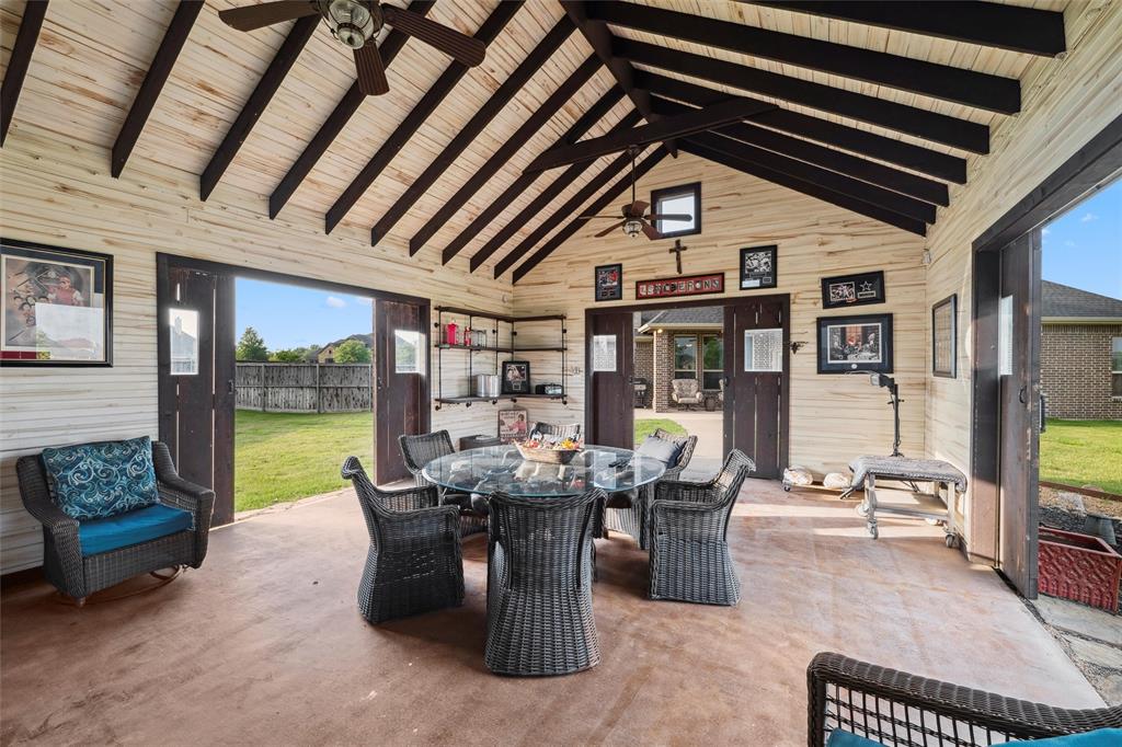 112 Shepherds Hill Road Waxahachie, TX 75165 - Photo 29 of 38 a dining room with furniture and a floor to ceiling window