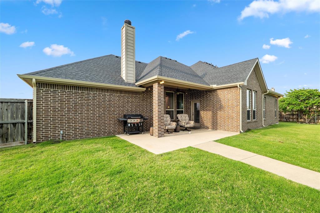 112 Shepherds Hill Road Waxahachie, TX 75165 - Photo 30 of 38 a view of a house with table and chairs in the patio