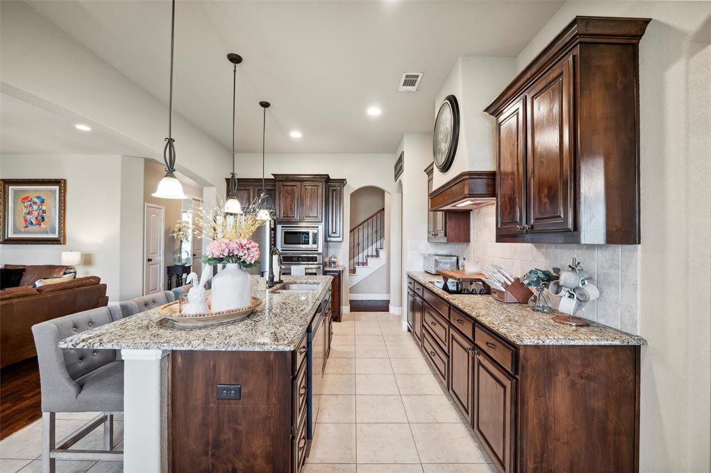 112 Shepherds Hill Road Waxahachie, TX 75165 - Photo 10 of 38 a kitchen with granite countertop lots of counter top space