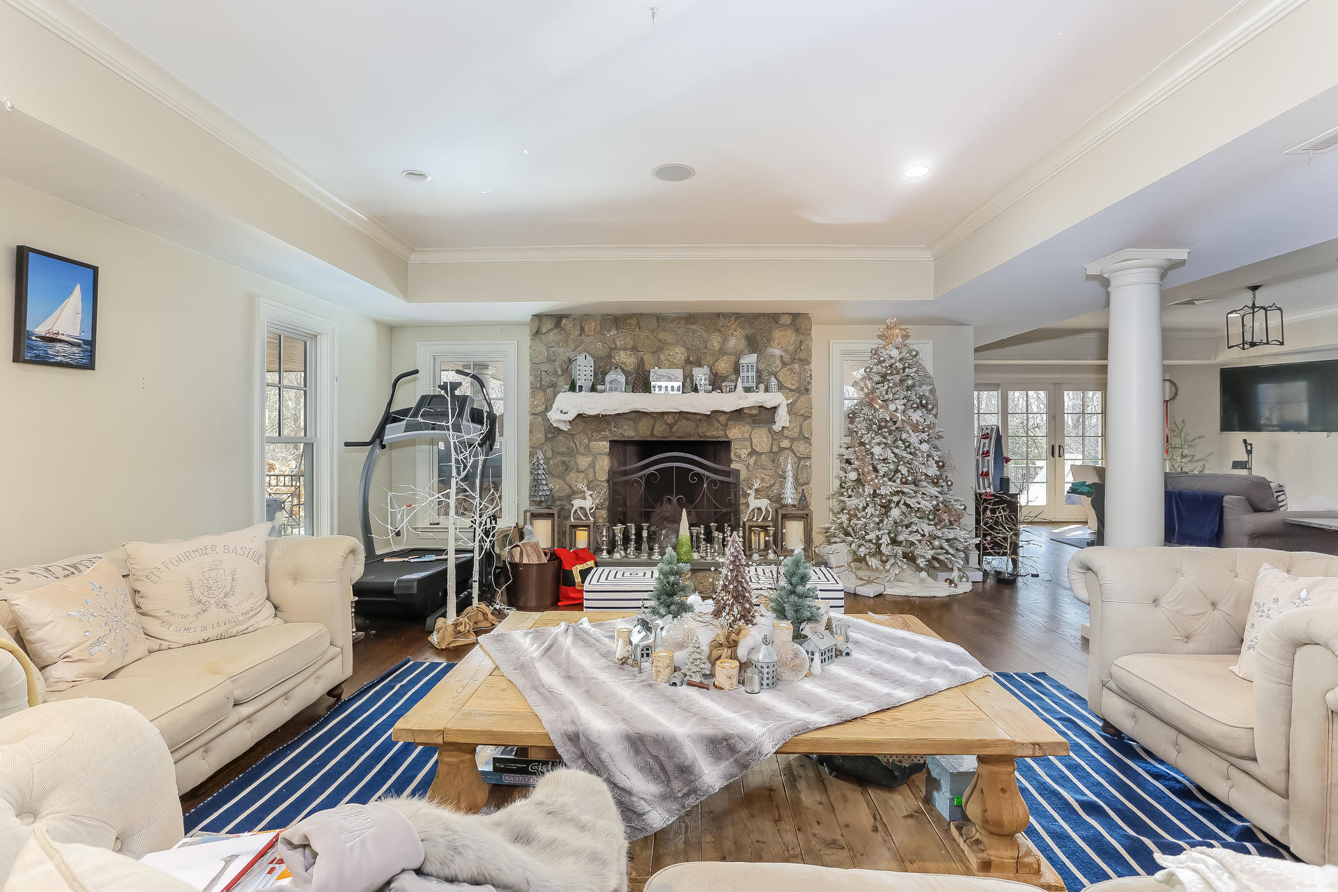 131 Thayer Pond Road New Canaan, CT 06840 - Photo 12 of 21 a living room with furniture and a fireplace