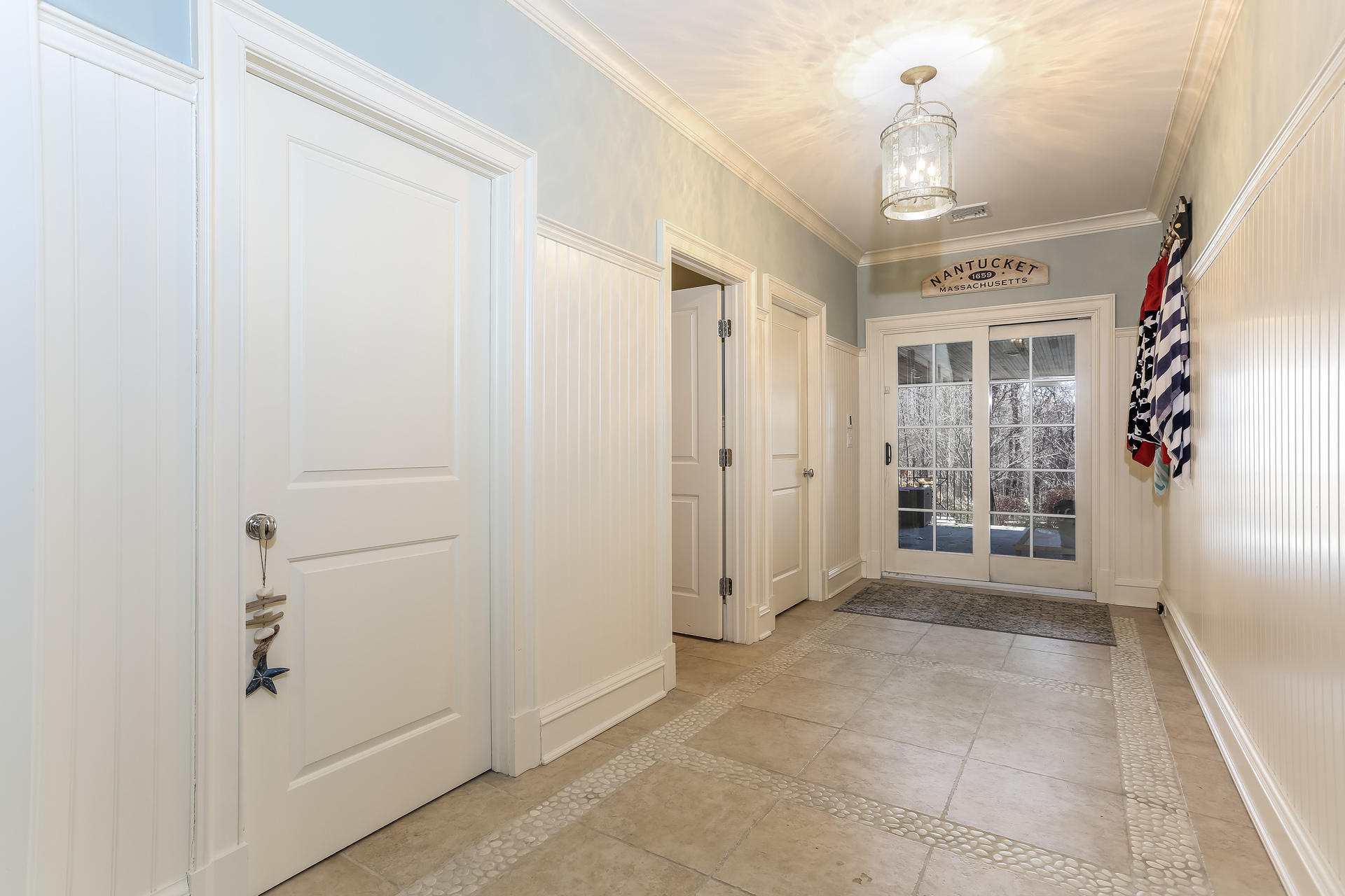 131 Thayer Pond Road New Canaan, CT 06840 - Photo 13 of 21 a view of a hallway with wooden shelves