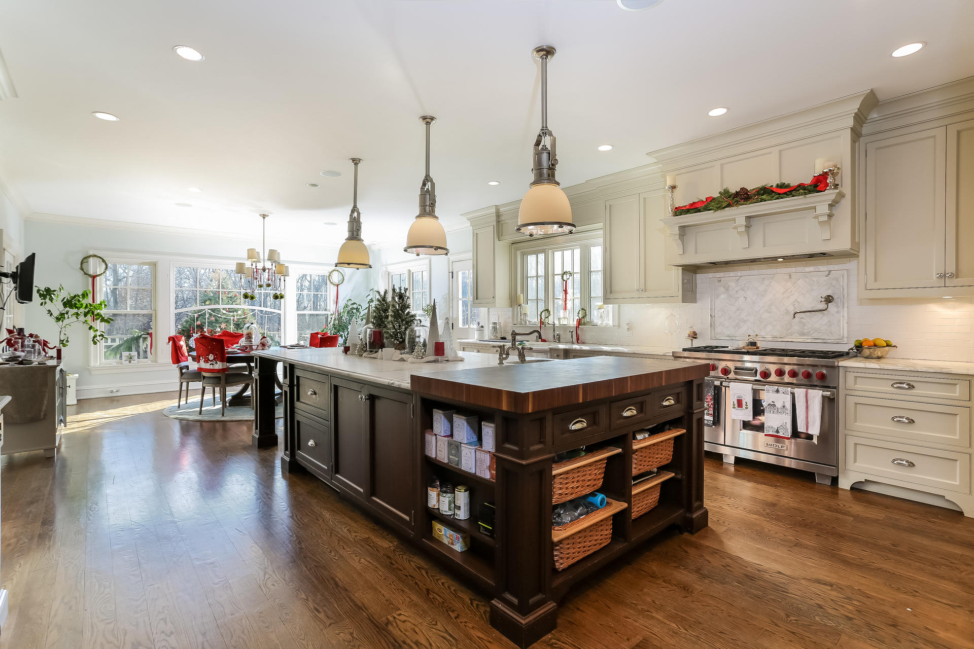 131 Thayer Pond Road New Canaan, CT 06840 - Photo 4 of 21 a kitchen with stainless steel appliances granite countertop a stove and a wooden floors