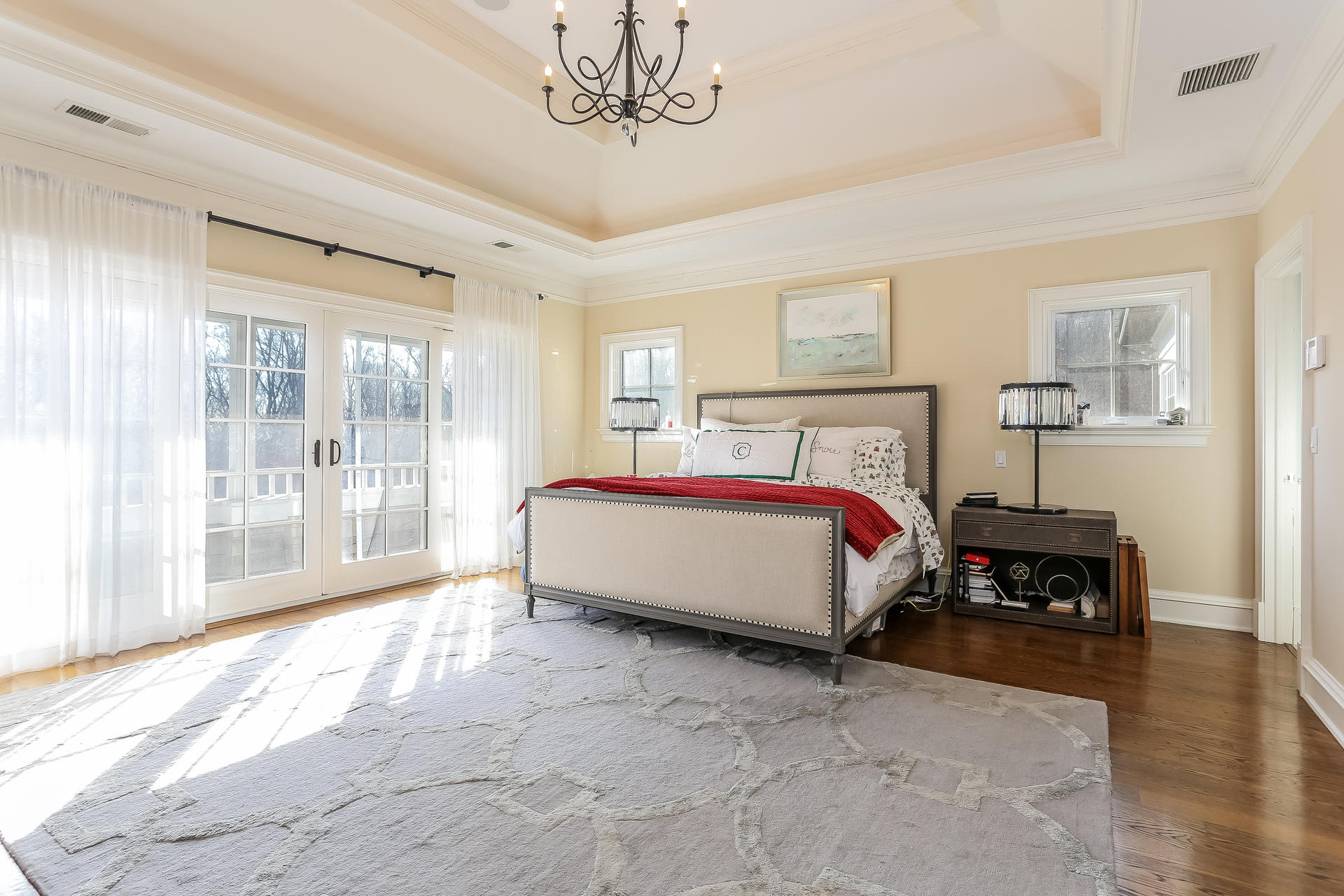 131 Thayer Pond Road New Canaan, CT 06840 - Photo 9 of 21 a bed sitting in a spacious bedroom next to a window