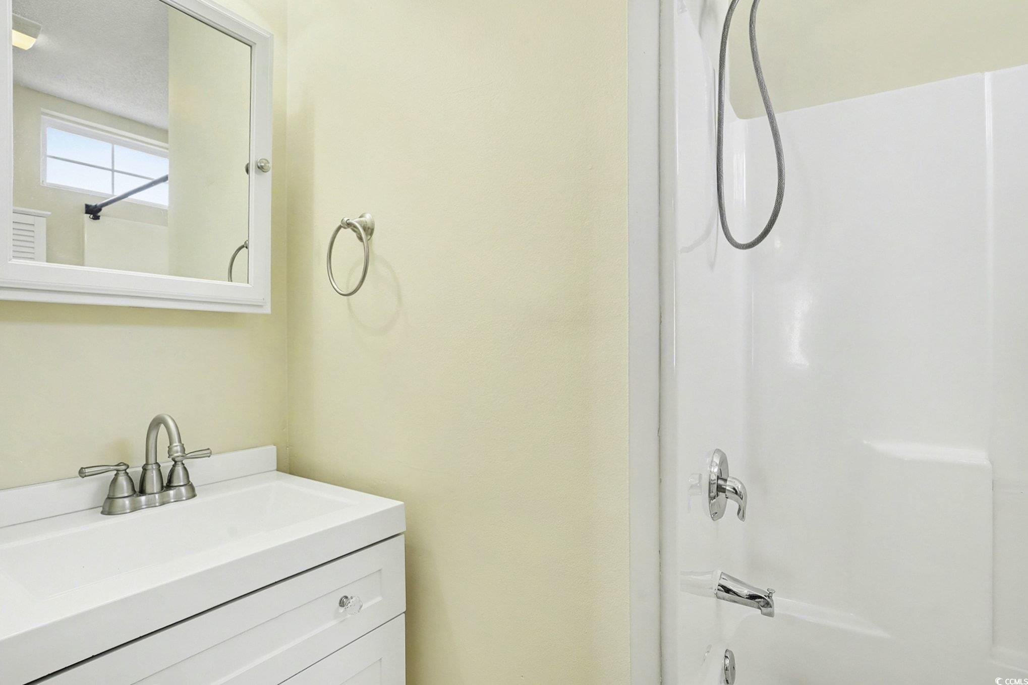 609 Sailbrooke Court, Unit 105 Murrells Inlet, SC 29576 - Photo 16 of 23 Bathroom featuring vanity and shower / washtub combination
