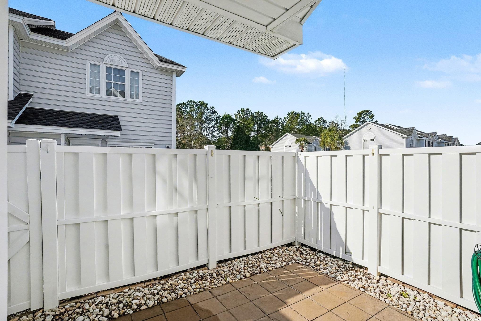 609 Sailbrooke Court, Unit 105 Murrells Inlet, SC 29576 - Photo 20 of 23 View of fenced backyard