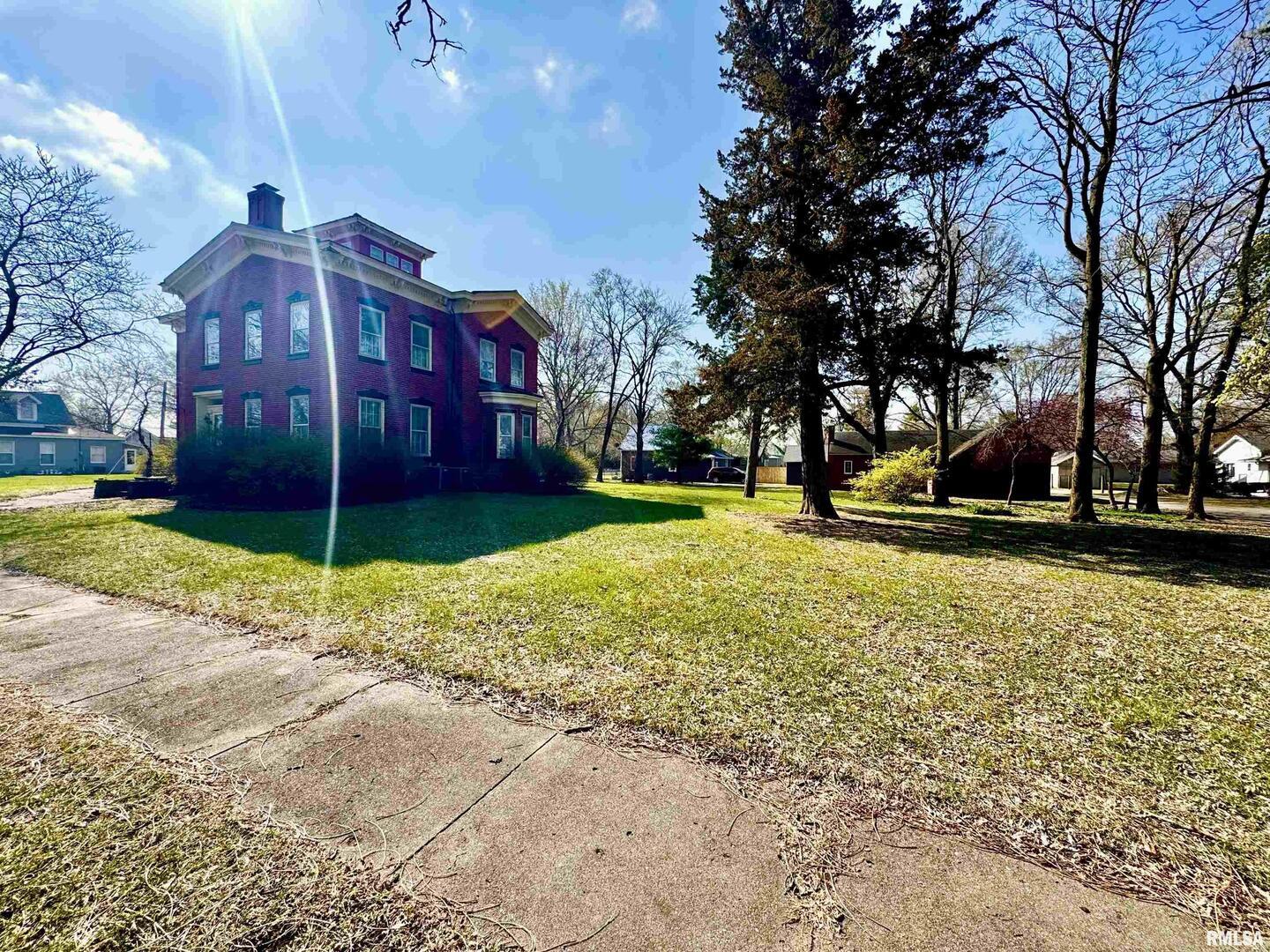 110 East Jefferson Street New Boston, IL 61272 - Photo 6 of 23 a view of a building with a yard