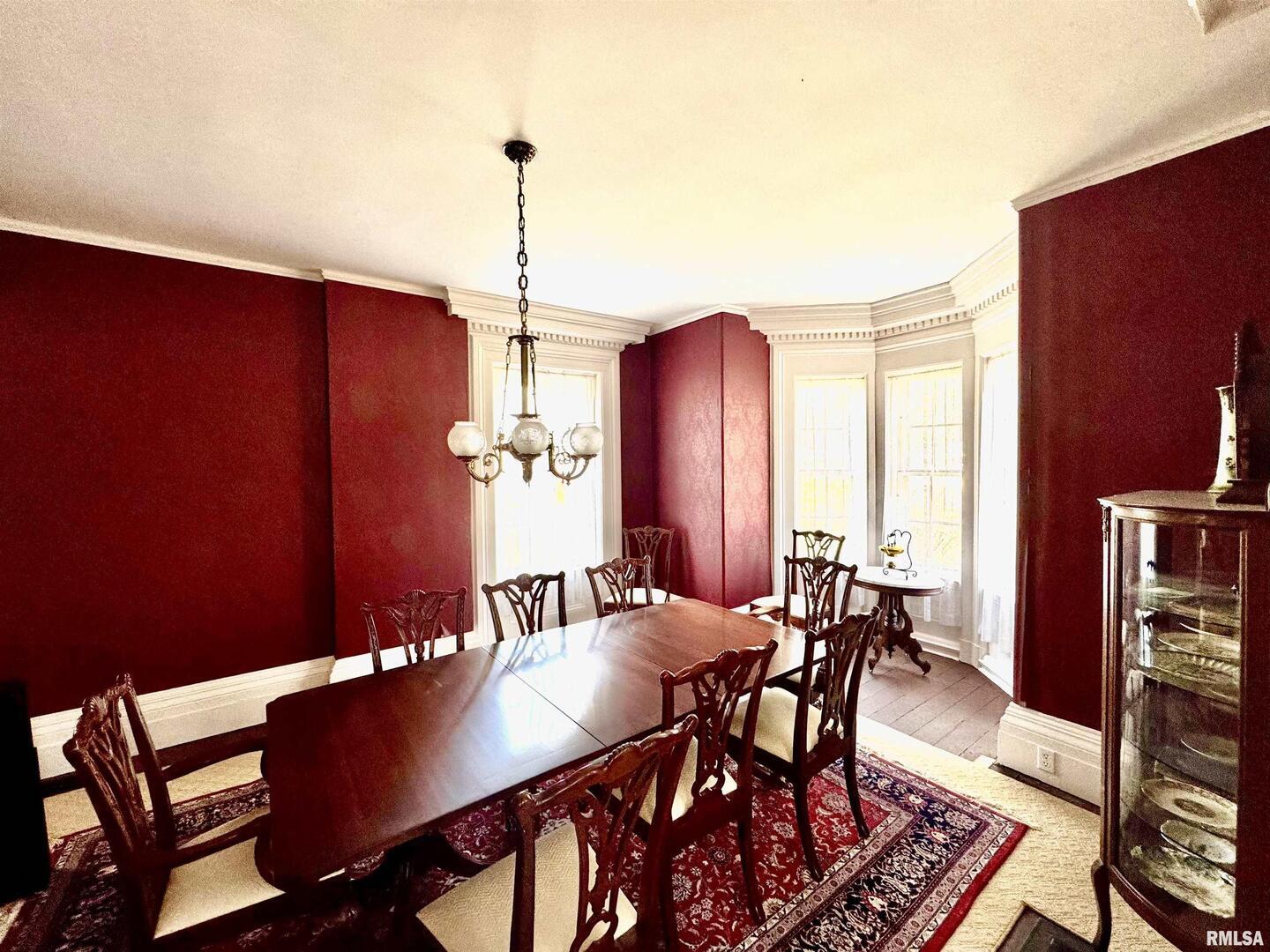 110 East Jefferson Street New Boston, IL 61272 - Photo 10 of 23 a view of a dining room with furniture window and wooden floor
