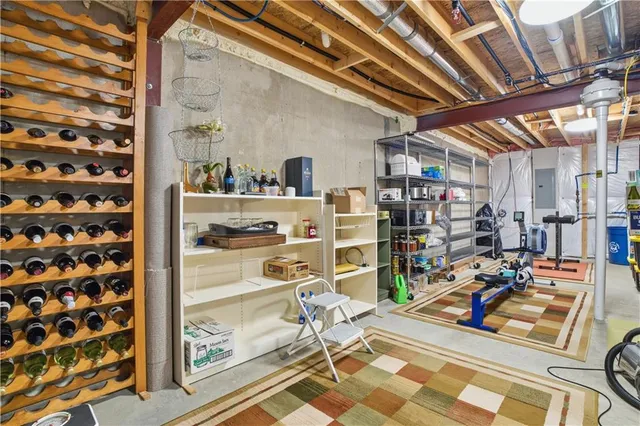 a view of a porch with furniture and wooden floor