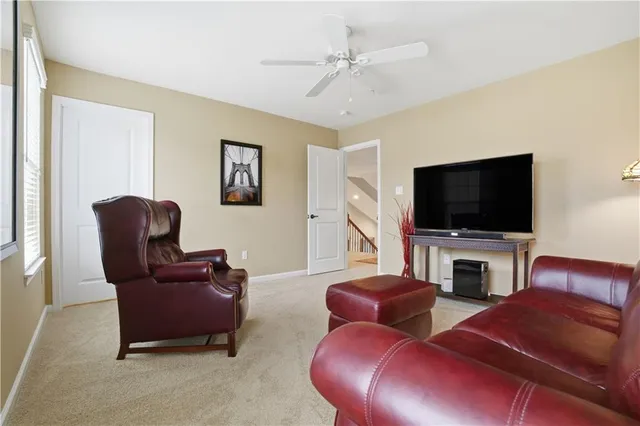 an aerial view of residential houses with a city street