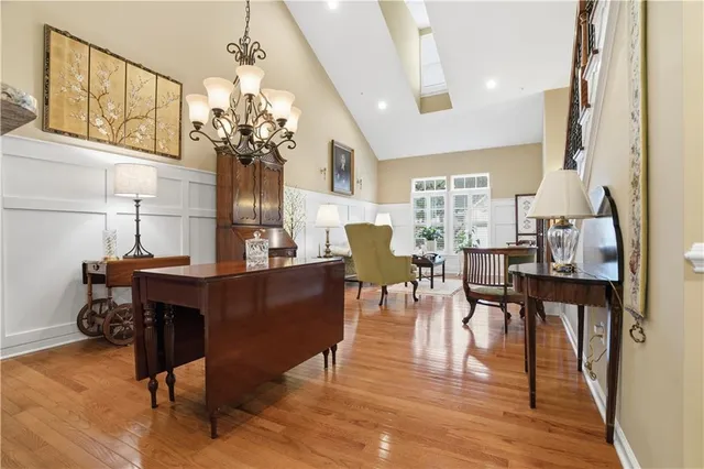 a view of a dining room with furniture and wooden floor