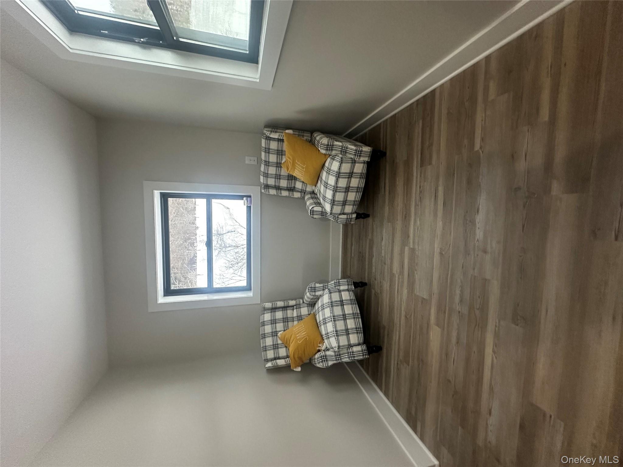 161 Hazel Road Livingston Manor, NY 12758 - Photo 10 of 24 Living area with baseboards and dark wood-style floors