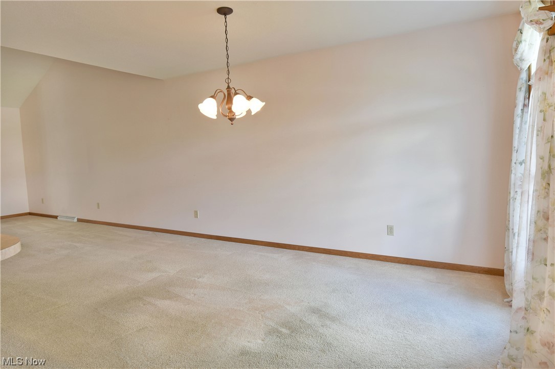 2033 East River Road, Unit 11 Newton Falls, OH 44444 - Photo 9 of 35 View of carpeted empty room