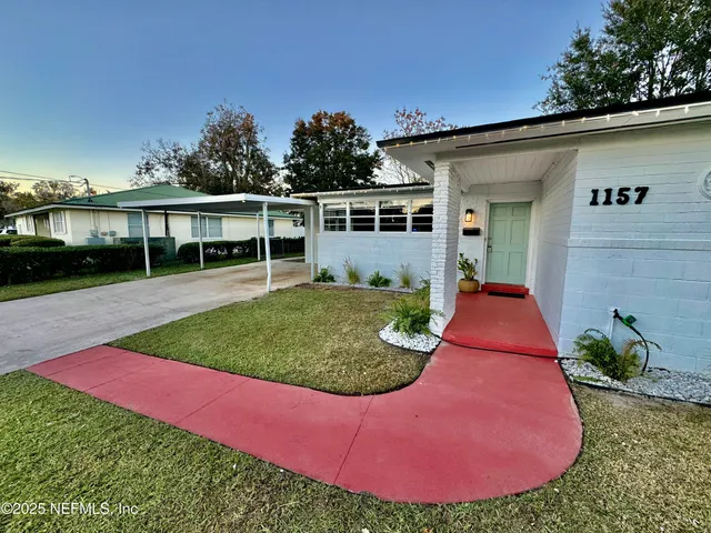 a view of a backyard with a garden and plants
