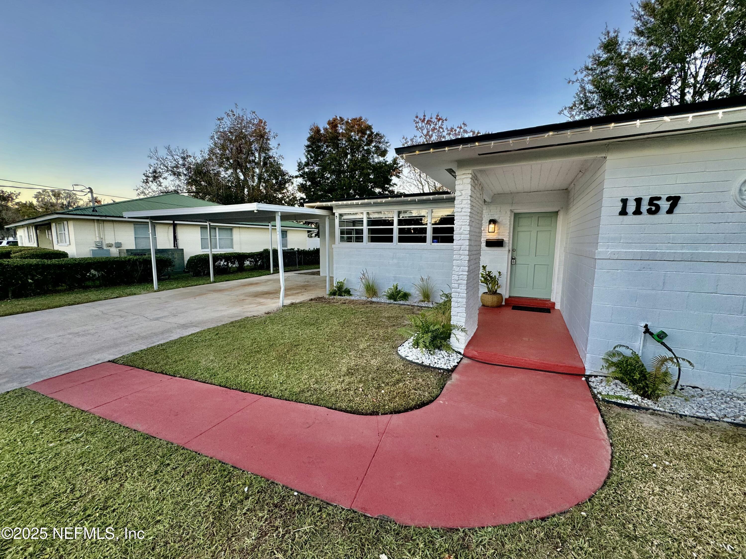 a view of a backyard with a garden and plants