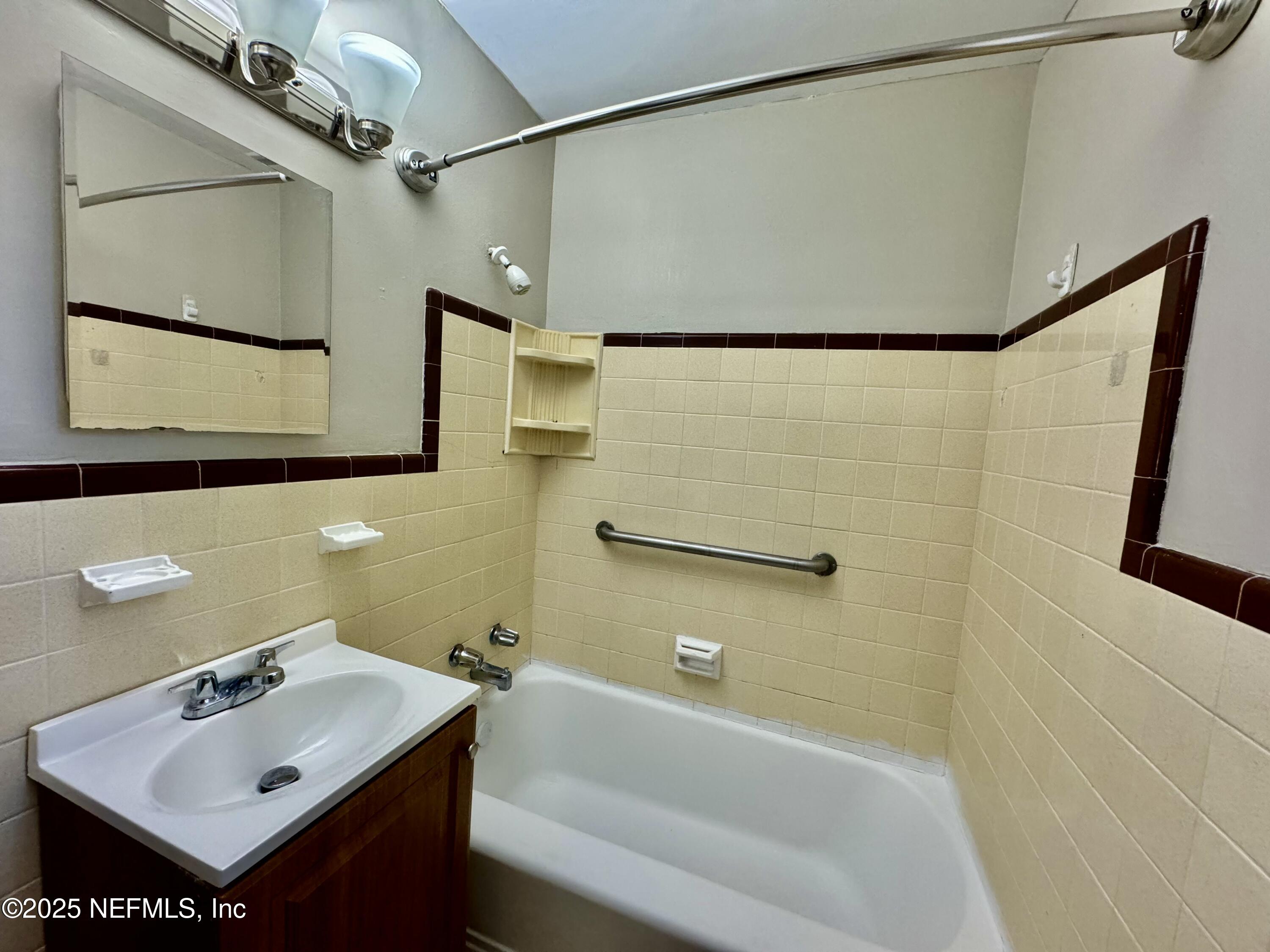 1157 Gunka Road Jacksonville, FL 32216 - Photo 18 of 24 a bathroom with a sink and a bathtub