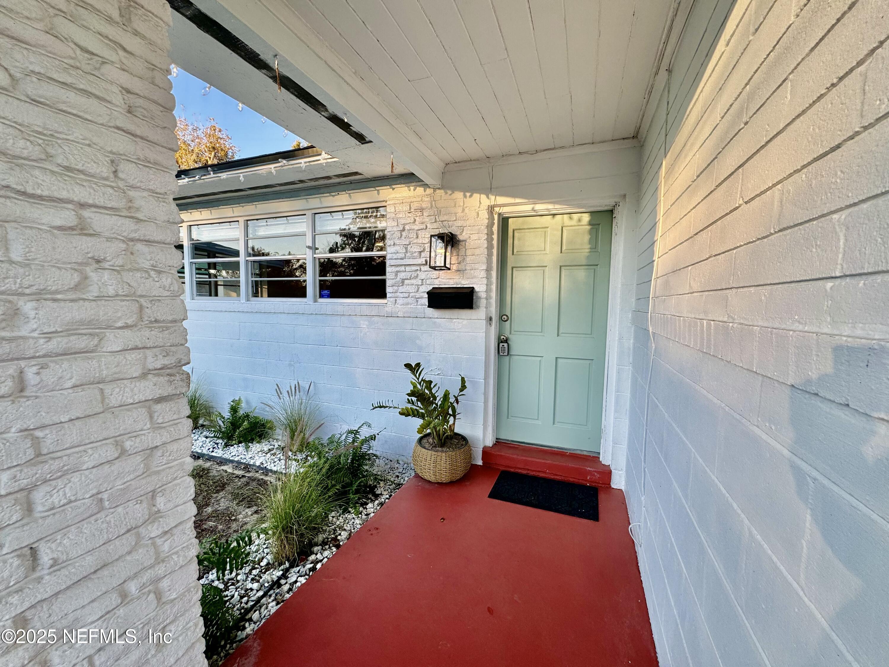 1157 Gunka Road Jacksonville, FL 32216 - Photo 4 of 24 a view of a porch