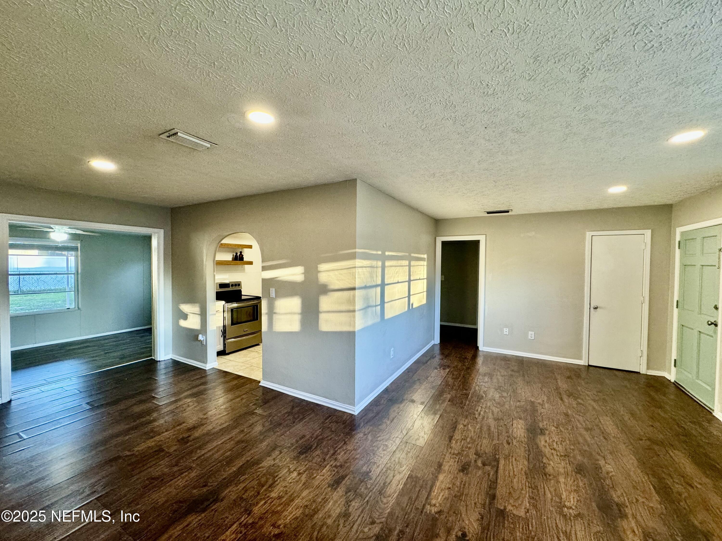 1157 Gunka Road Jacksonville, FL 32216 - Photo 6 of 24 a view of a room with wooden floor