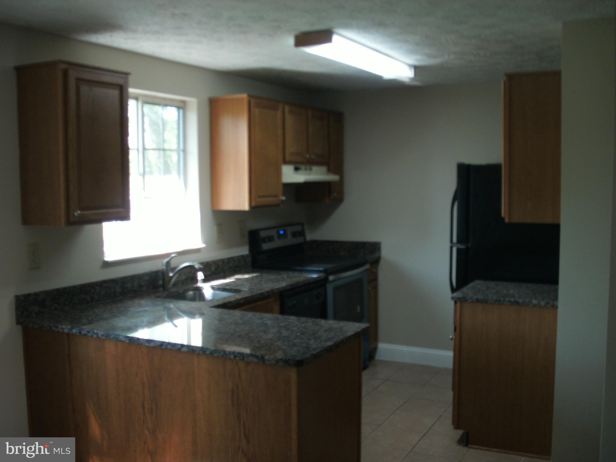 1411 Farmcrest Way Silver Spring, MD 20905 - Photo 3 of 28 Kitchen with granite countertops