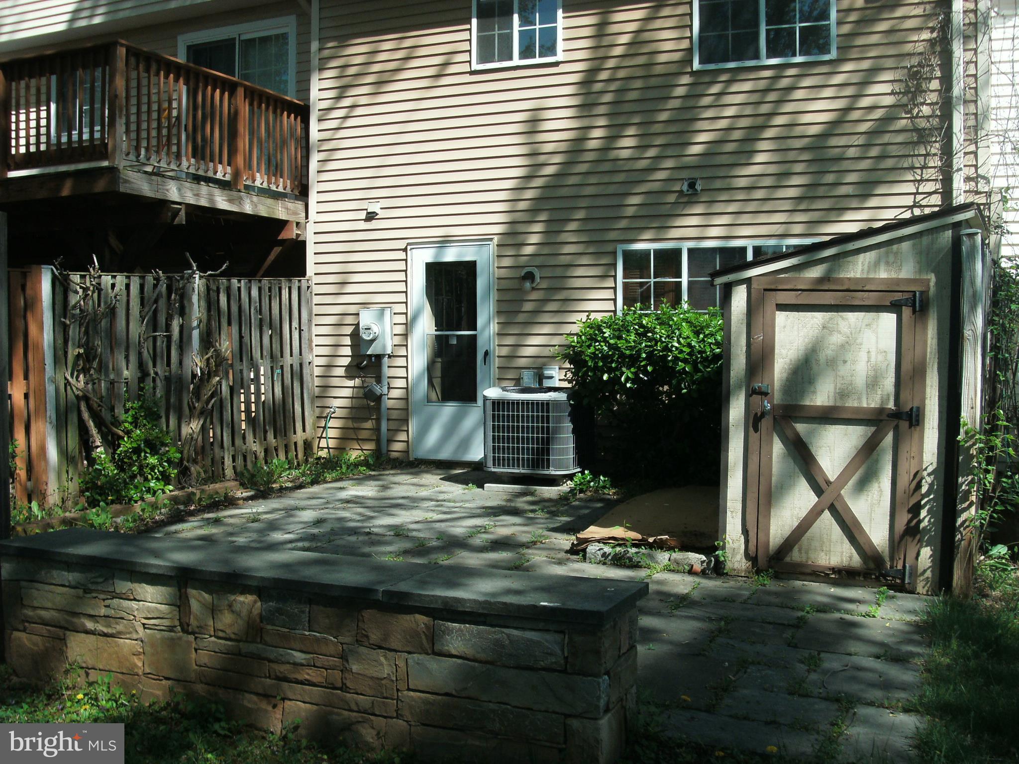 1411 Farmcrest Way Silver Spring, MD 20905 - Photo 27 of 28 Exterior (Rear) - patio, sitting wall with shed