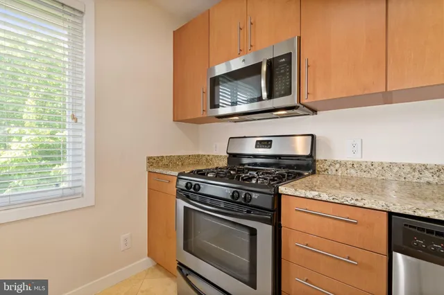 a kitchen with a stove and a microwave