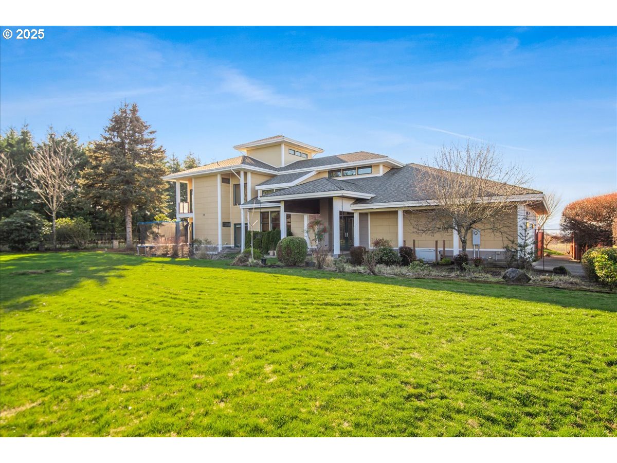 32230 Northeast Old Parrett Mountain Road Newberg, OR 97132 - Photo 6 of 14 a front view of a house with swimming pool having outdoor seating