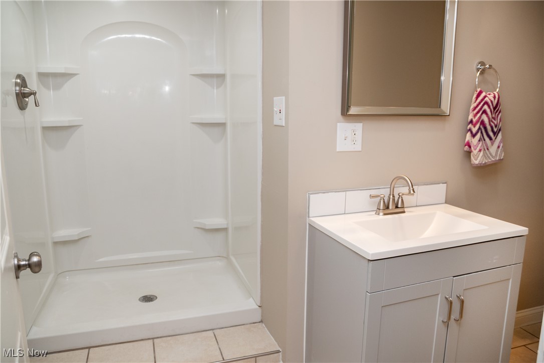 158 Morningside Road Niles, OH 44446 - Photo 24 of 36 Bathroom featuring vanity, tile patterned new shower insert. walk in shower