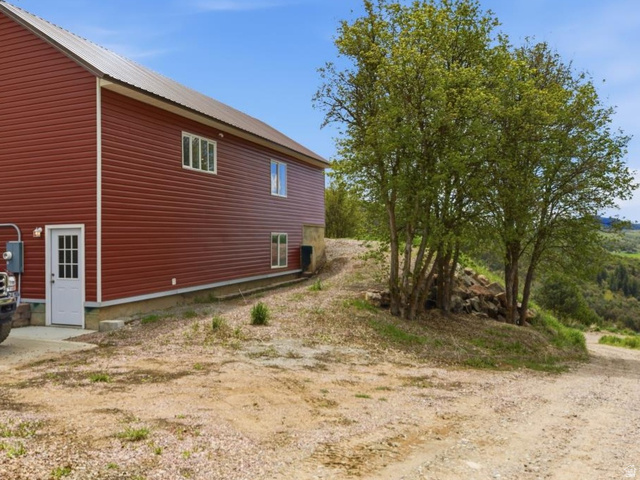 916 North Bonneville Road Preston, ID 83263 - Photo 26 of 37 View of side of property featuring a metal roof