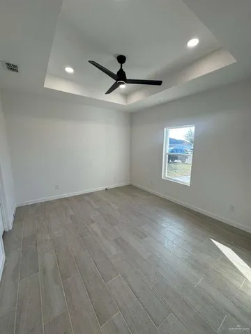 an empty room with a empty space and windows