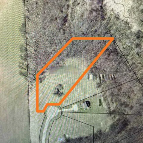 a red and white bench sitting in front of a building